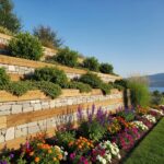 modern-retaining-wall-design-in-a-landscaped-garden-in-vernon-bc-showcasing-stone-and-timber-materials